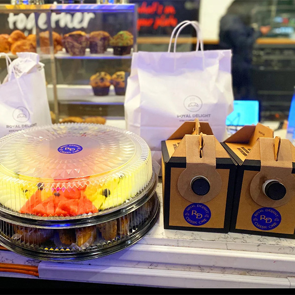 A fruit tray and coffee boxes prepared for corporate catering near Court Square, Queens, New York.